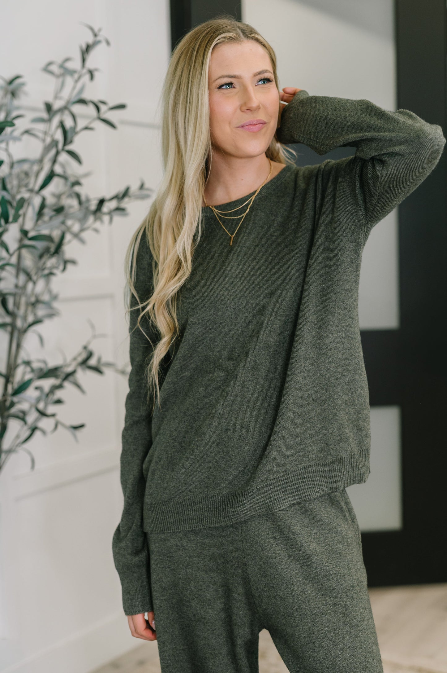 Front view of Clove Sweater in Moss with ribbed knit and oversized fit