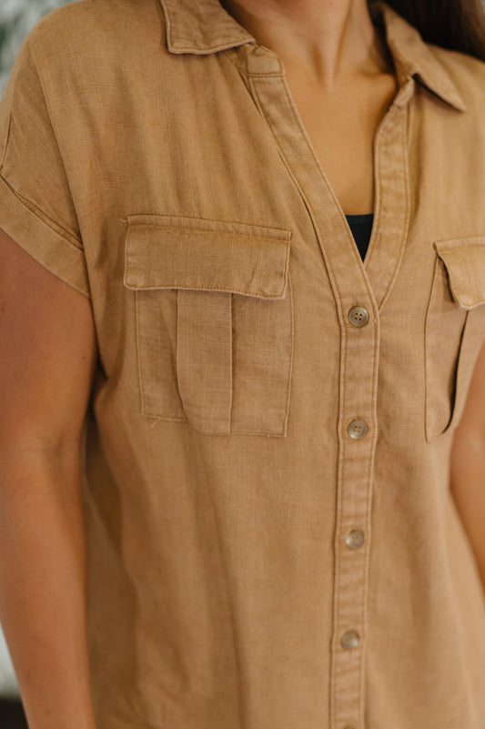 Close up of Waverly Blouse in deep camel showing button detail and pockets