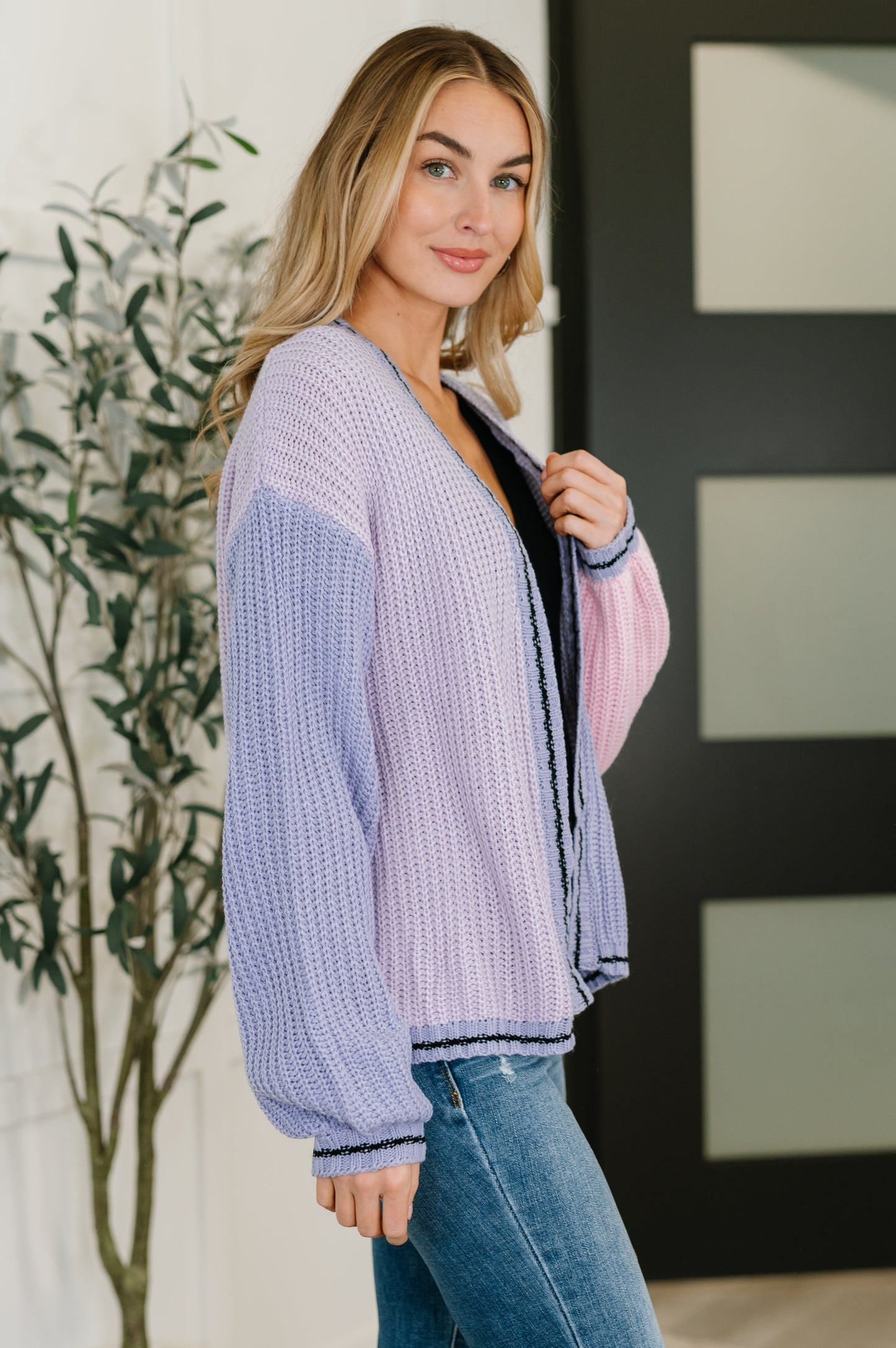 Side angle of Coraline Color Block Cardigan highlighting relaxed fit and soft knit texture.
