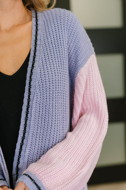 Close-up of Coraline Color Block Cardigan showing ribbed edges and soft sweater knit fabric.
