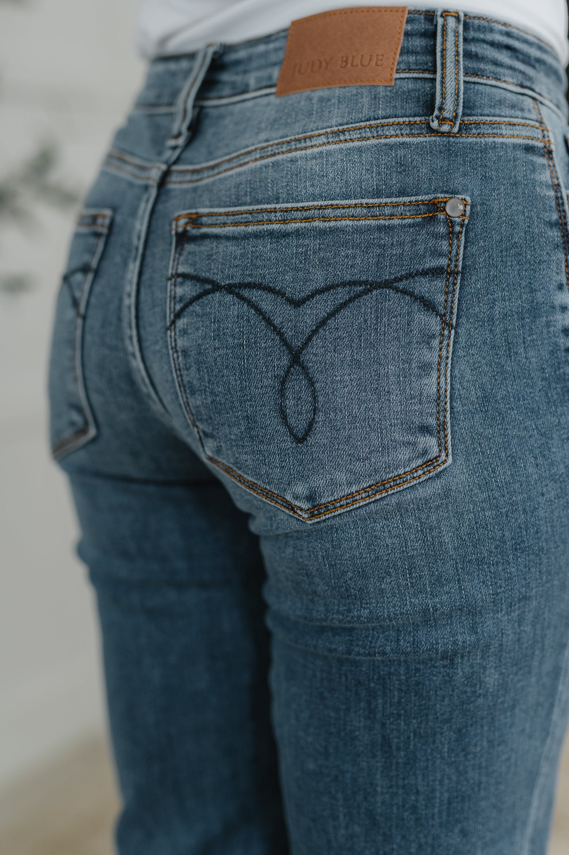 Close-up of Judy Blue Colette Mid Rise Boyfriend Jeans highlighting pocket and stretch denim.