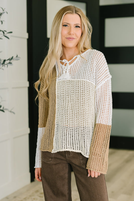 Danielle Loose Knit Sweater in beige with V-neck and tie detail, drop shoulder design.
