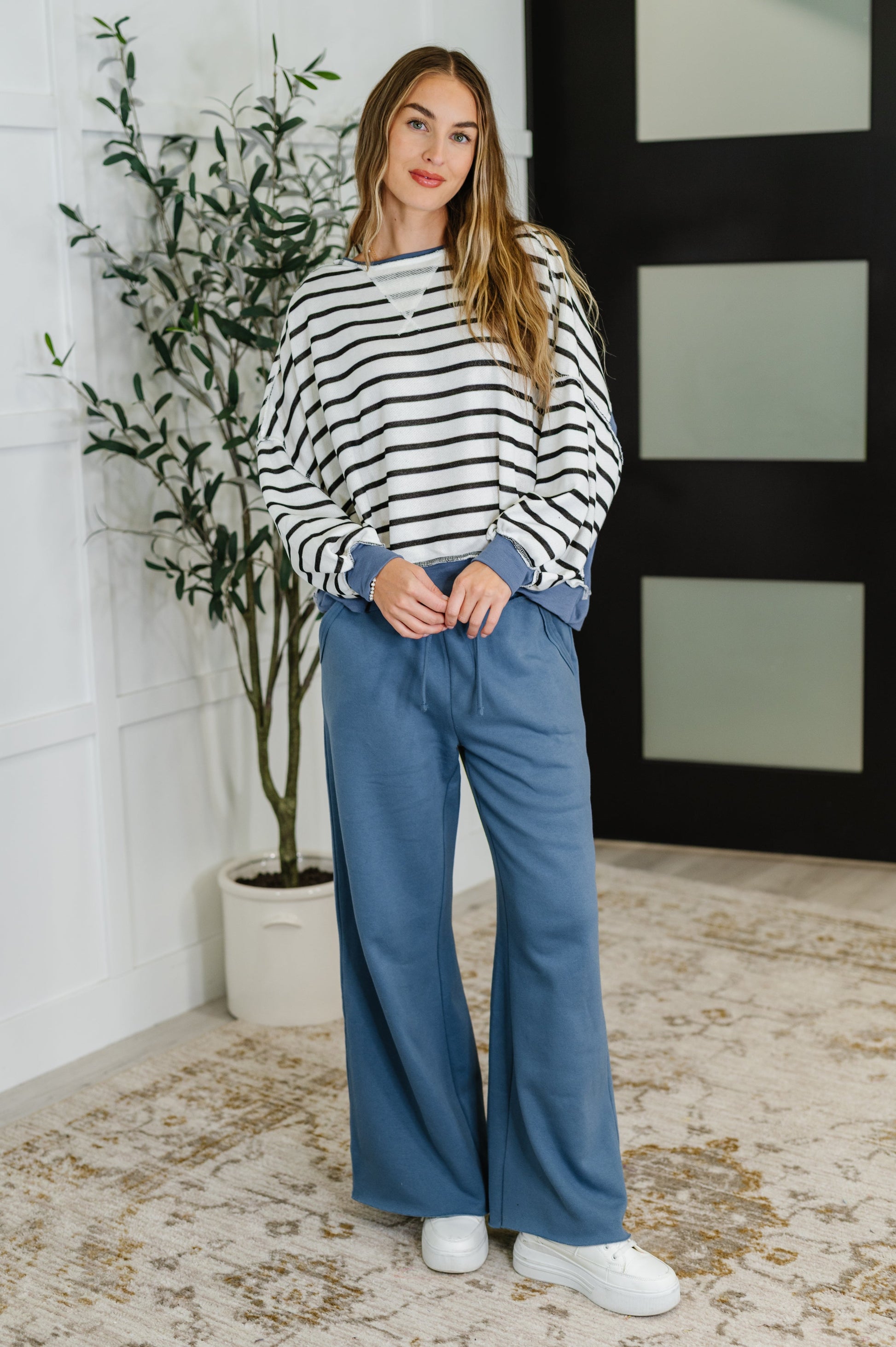 Cozy French terry striped pullover with long sleeves and modern edge.