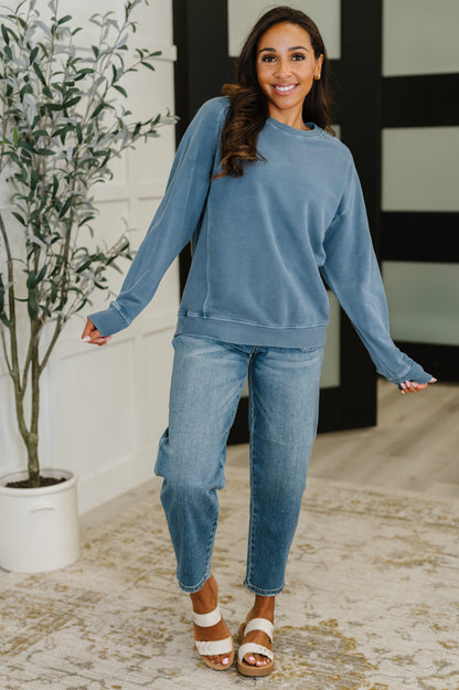 Full body view of Nicia Dusty Blue Mineral Wash Pullover styled casually