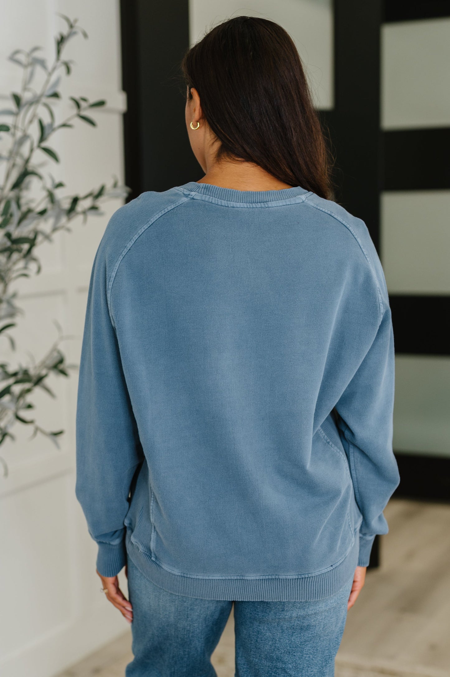 Back of Nicia Dusty Blue Mineral Wash Pullover showing washed fabric and casual fit