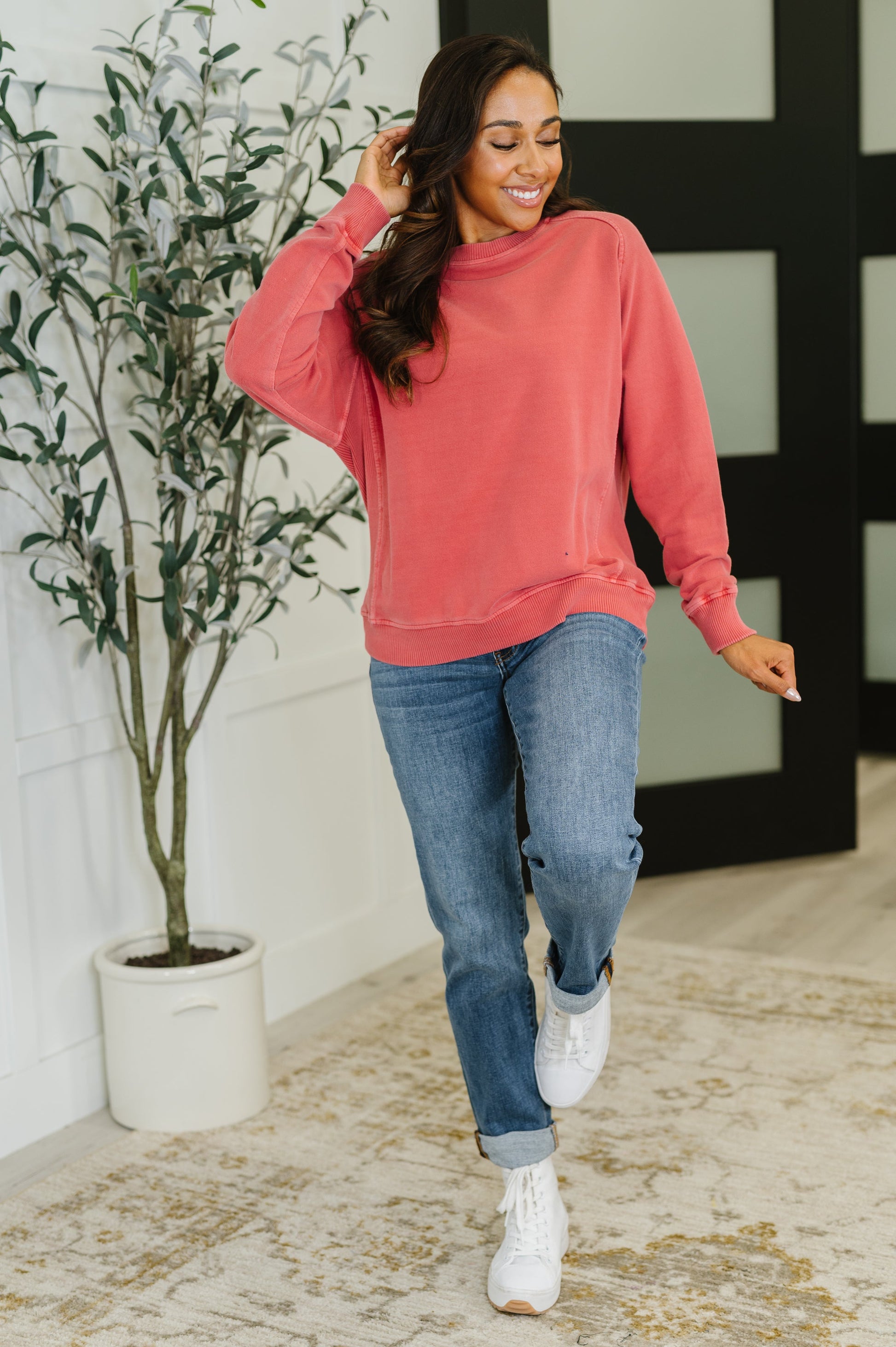Full body view of Nicia Ruby Mineral Wash Pullover styled with jeans