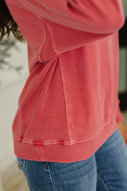 Close-up of Nicia Ruby Mineral Wash Pullover, ribbed cuff sleeve and knit contrast detail