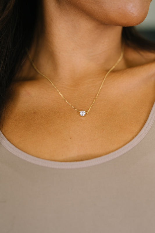Dainty Daydreams Necklace in gold-plated silver with sparkling zircon charm.