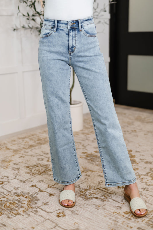 Woman wearing Debbie high rise stone wash straight jeans, front view casual Judy Blue denim.