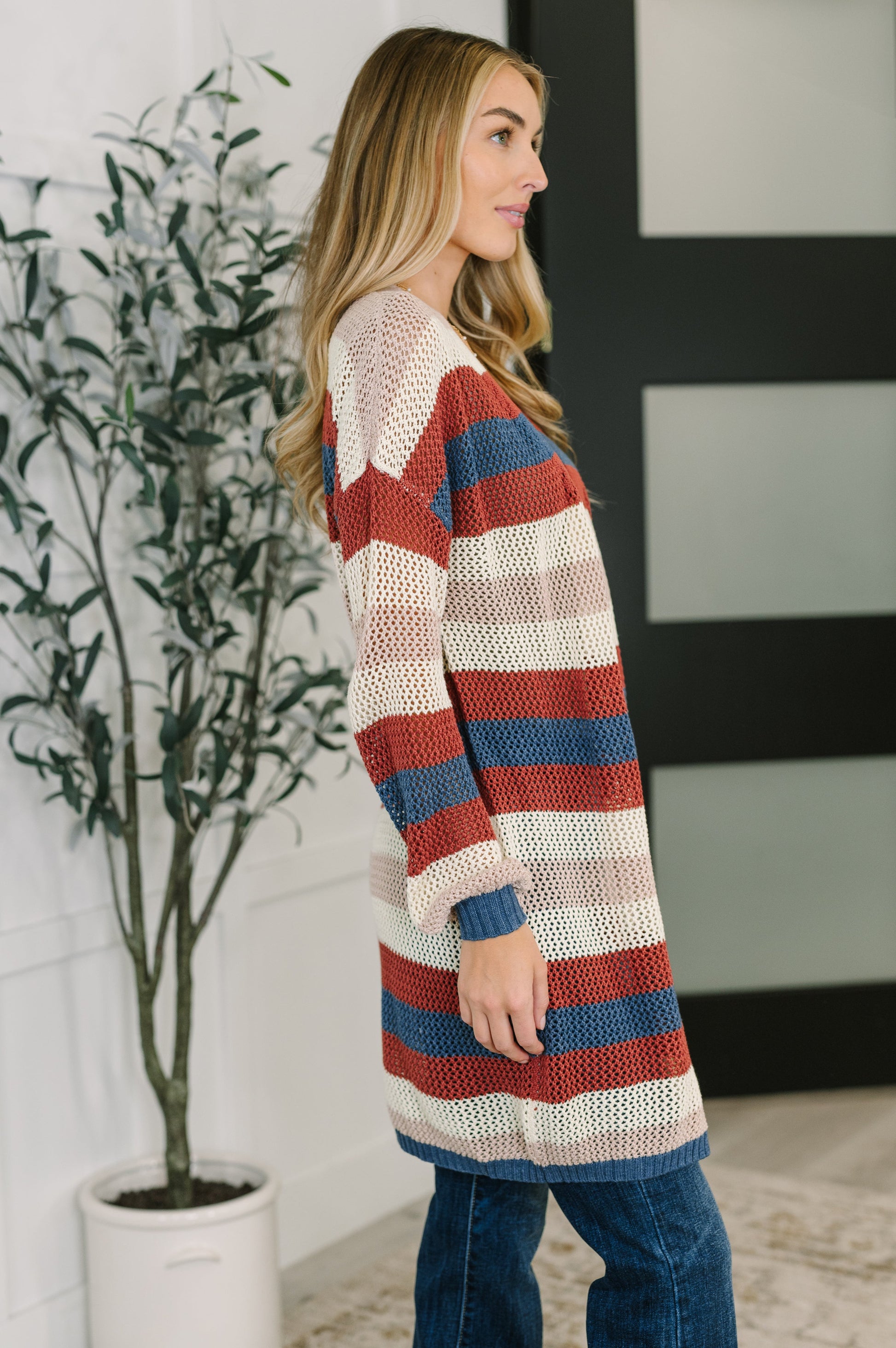 Side view of Carly Striped Knit Cardigan highlighting long sleeves and breathable knit.