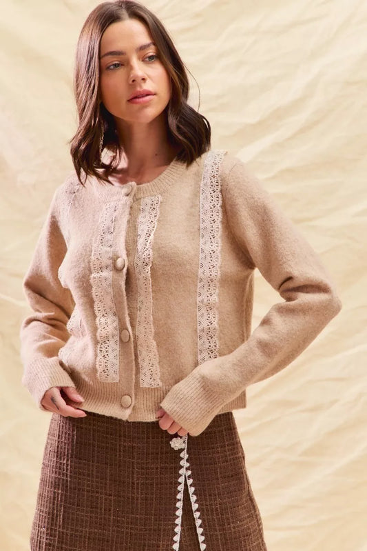 Model wearing Demitria Front Lace Trim Cardigan in oatmeal sweater knit.