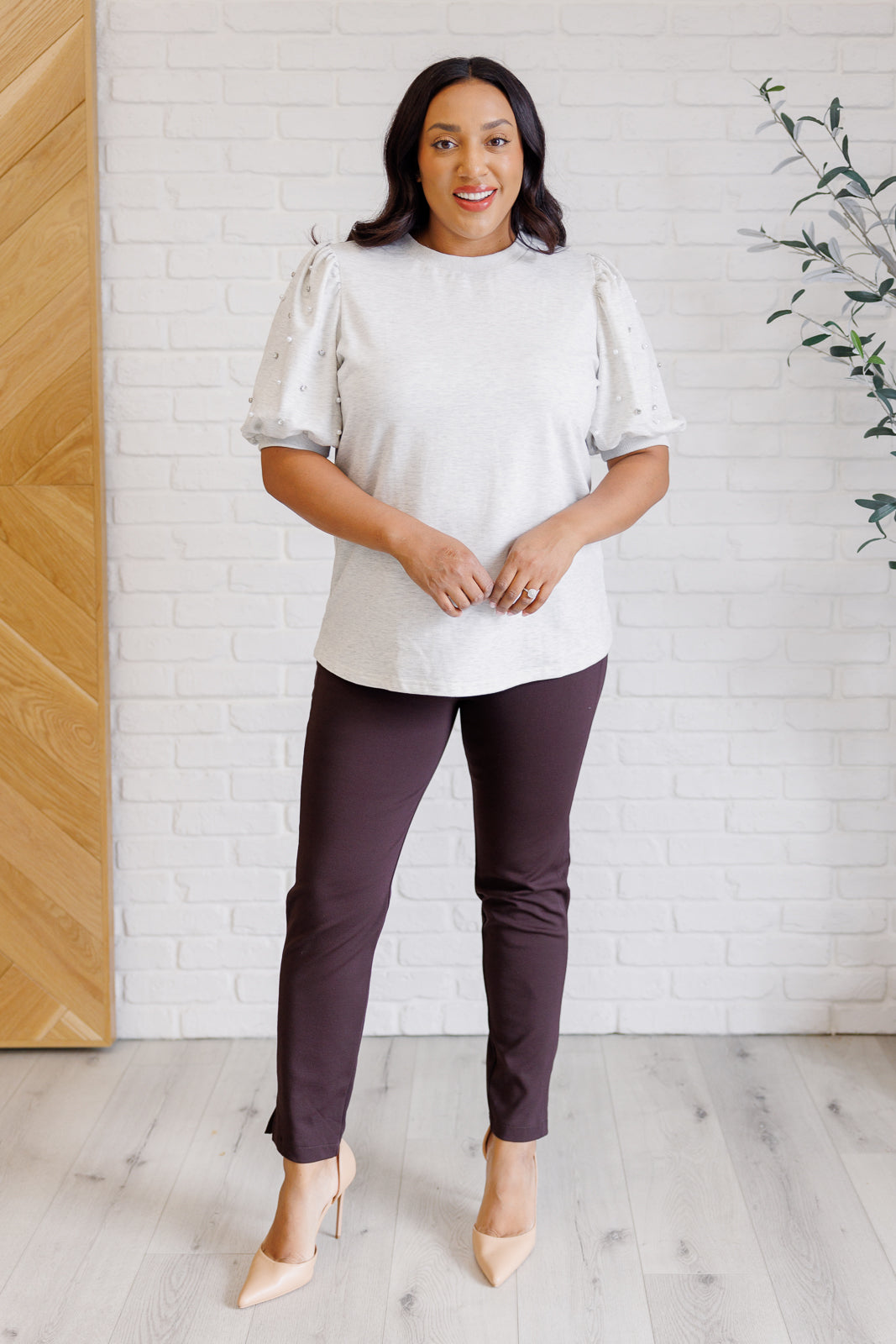 Light gray French terry top with a ribbed neckline, short balloon sleeves embellished with pearl and faux diamond accents, and ribbed sleeve cuffs.