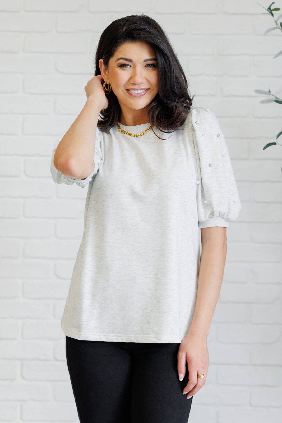 Light gray French terry top with a ribbed neckline, short balloon sleeves embellished with pearl and faux diamond accents, and ribbed sleeve cuffs.