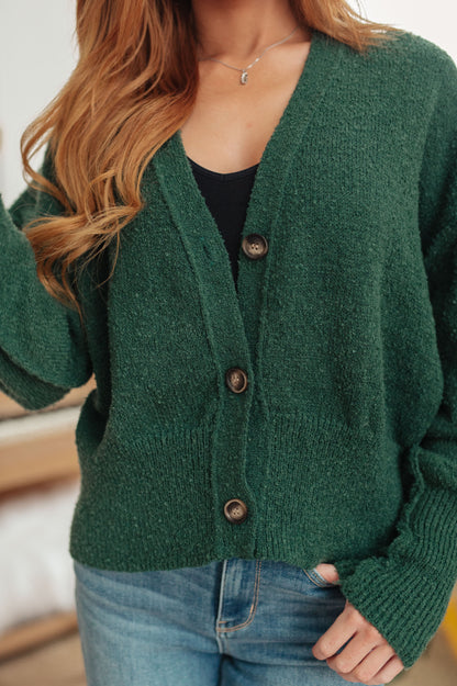 Close-up of Dido Cardigan in Green showing v-neckline and ribbed detailing.