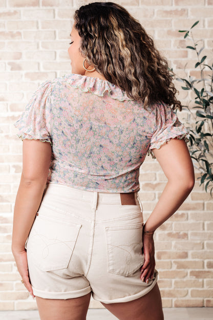 Plus size floral mesh bodysuit back view with seamless fit and snap closure.