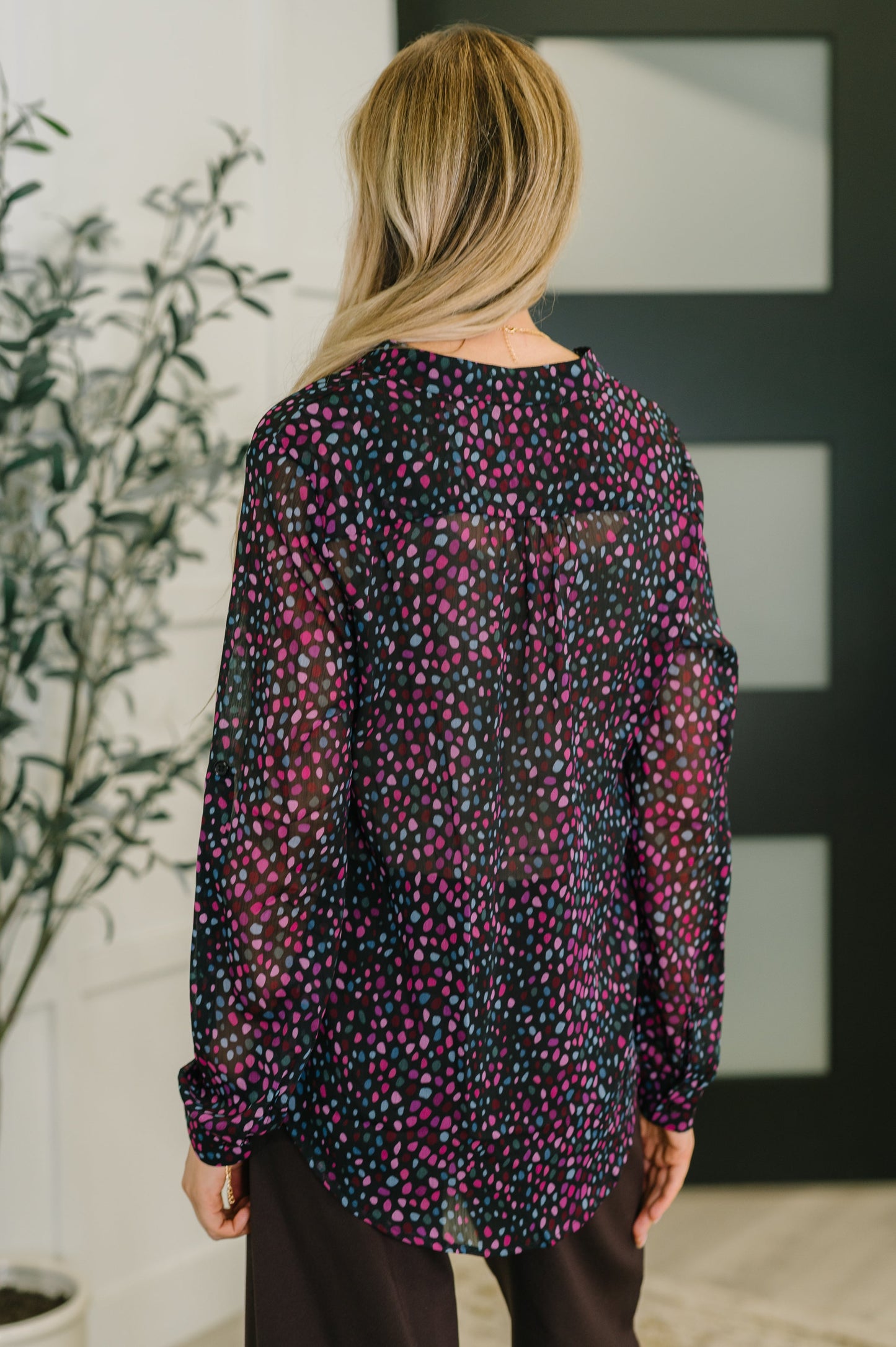 Back view of Miranda Polka Dot Blouse in black chiffon with pink and blue dots.