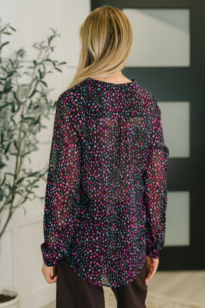 Back view of Miranda Polka Dot Blouse in black chiffon with pink and blue dots.