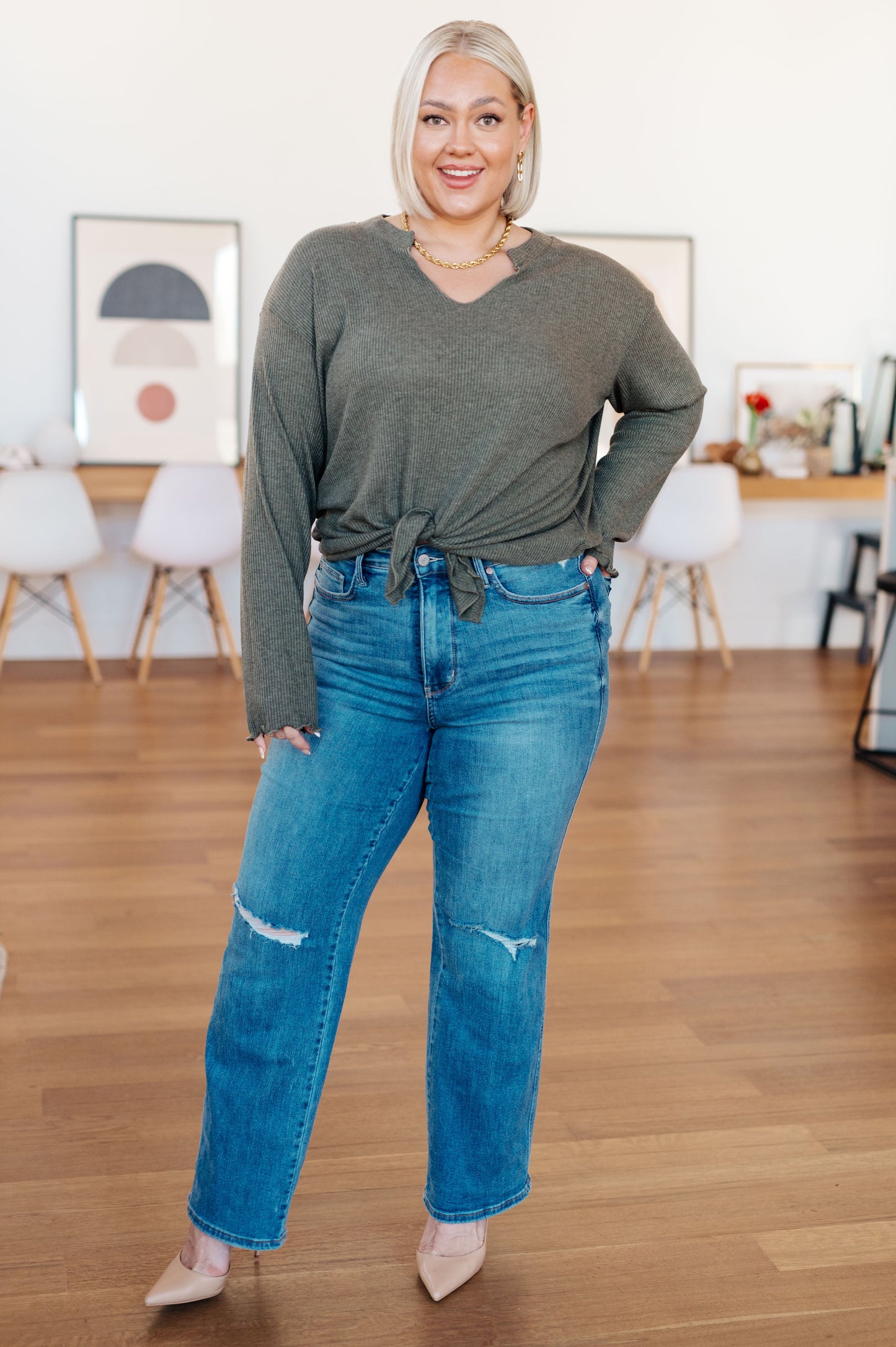 Sage gray ribbed knit top featuring a flirty front slit with tie detail, playful lettuce hem, and a flattering "Gabby" V-neckline, perfect for casual or chic outfits.