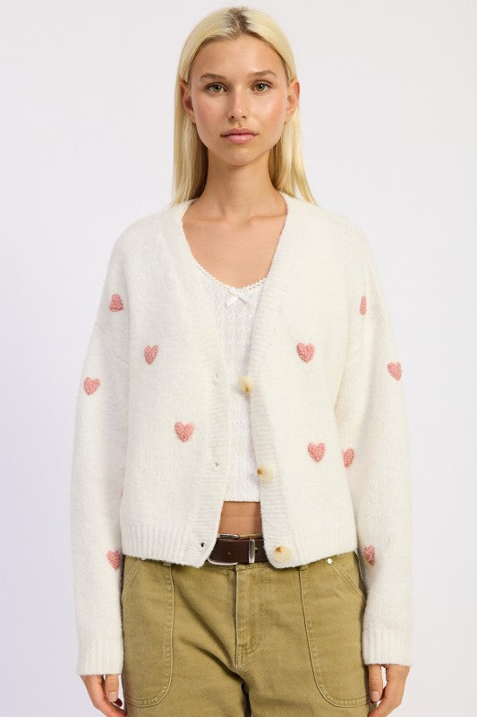 Donna Cropped Cardigan styled with high-waisted jeans for a flirty look.