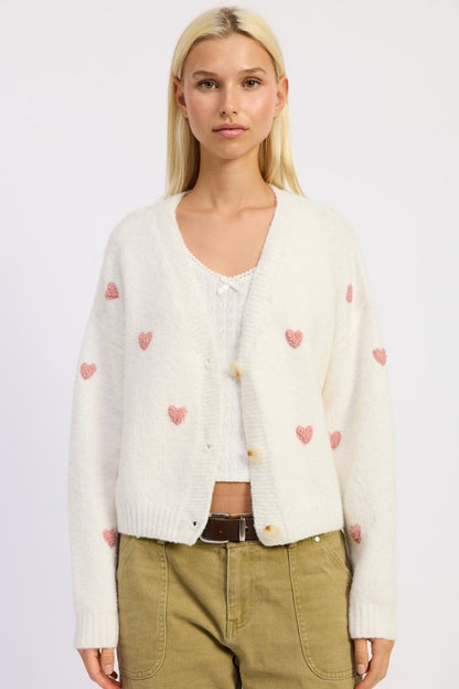 Donna Cropped Cardigan styled with high-waisted jeans for a flirty look.