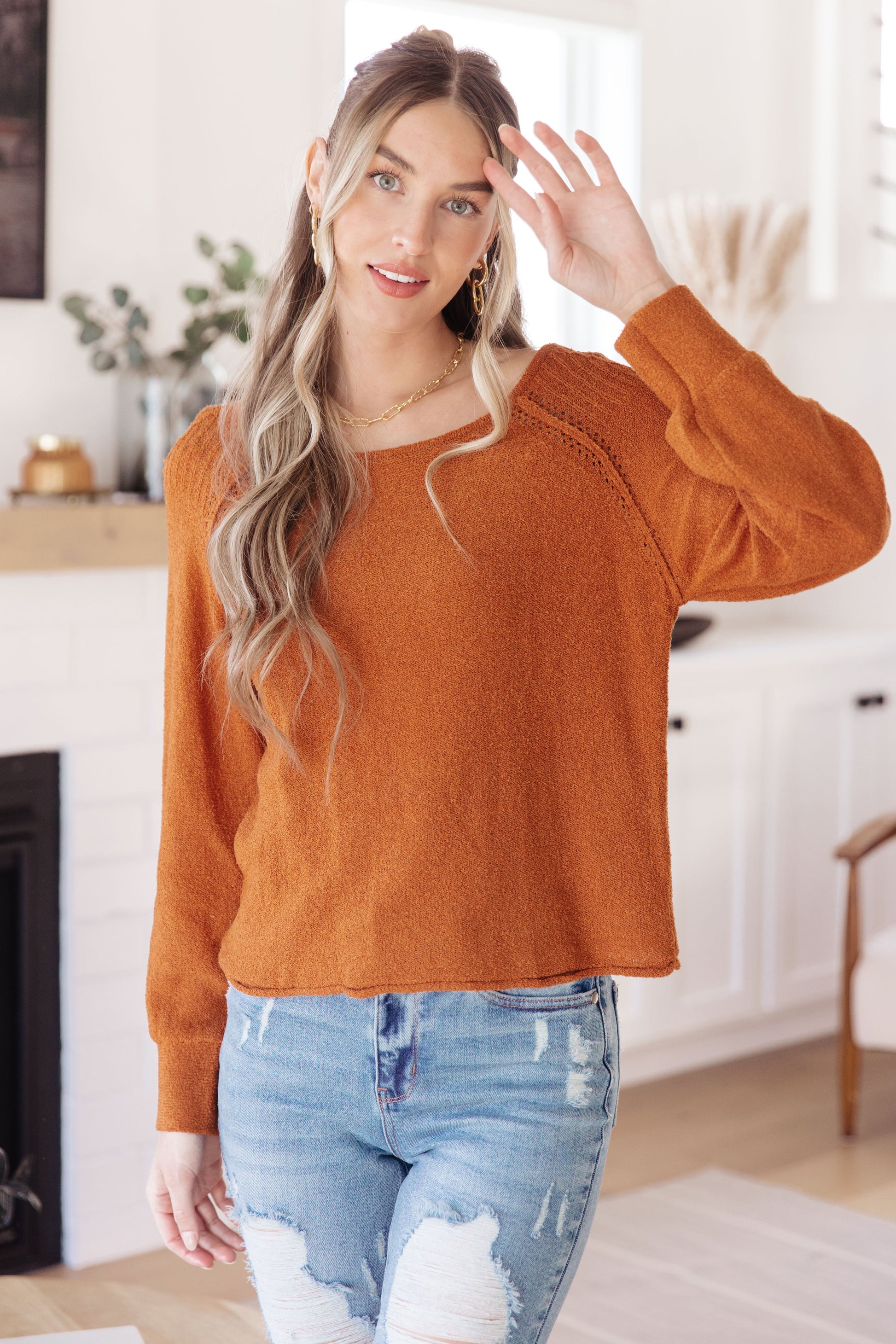 Front view of Dorothy Pullover Sweater in rust with raglan sleeves and exposed seams