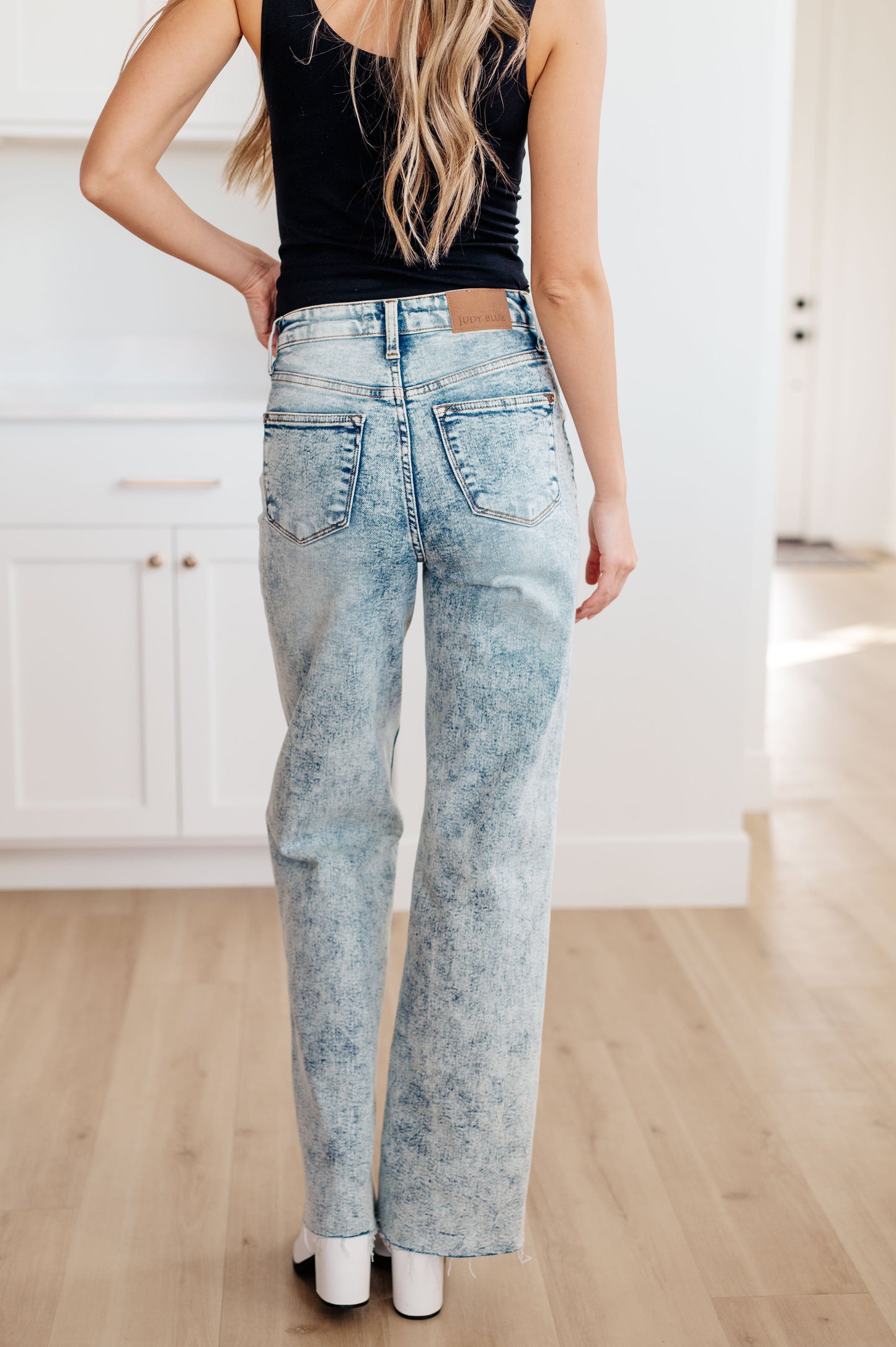 Judy Blue Dory High Waist Mineral Wash Raw Hem Wide Leg Jeans, featuring a zip fly, 4-way stretch, and a stylish raw hem for a trendy fit.