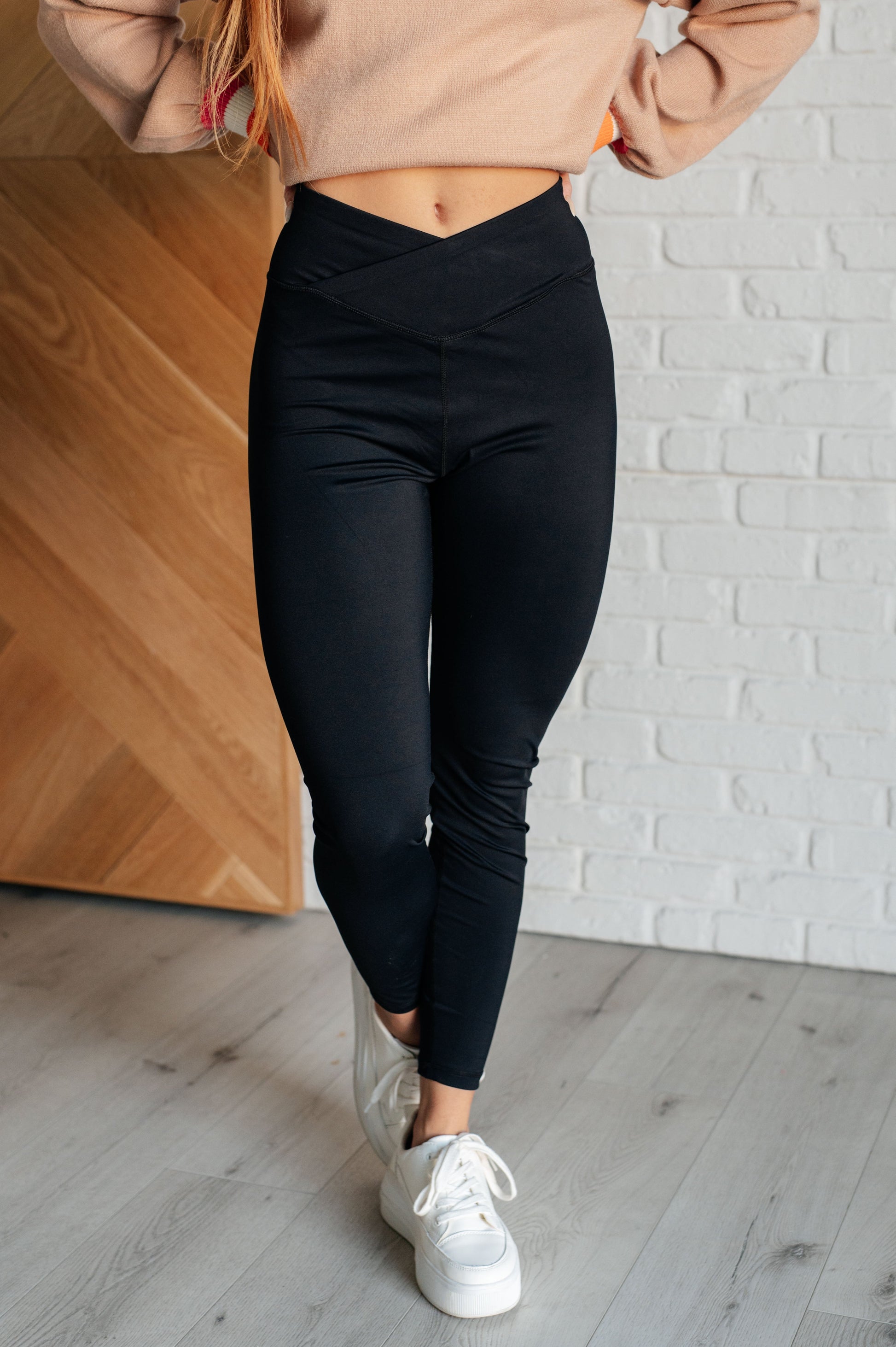 Women's black athletic leggings with a V-waistline, designed for comfort and performance.