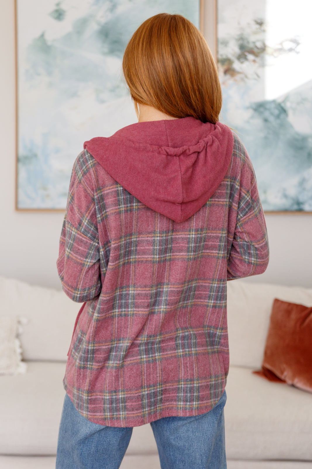 Women's Hooded Shacket in mauve plaid, featuring brushed plaid hacci fabric, hooded neckline, patch pocket, button front closure, and functional drawstring for a secure fit. 