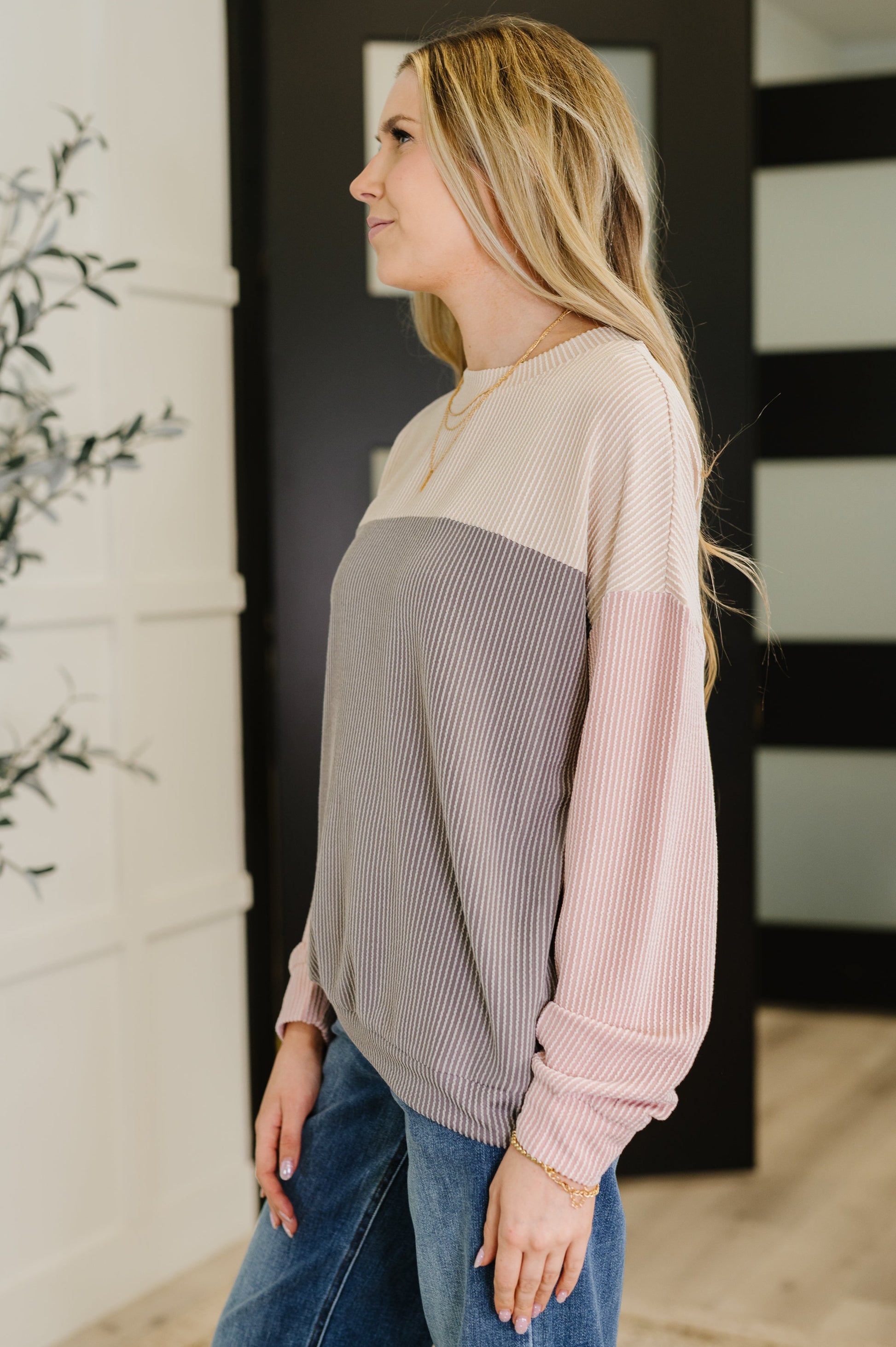 Side angle of Jaylani Color Block Pullover showing drop shoulders