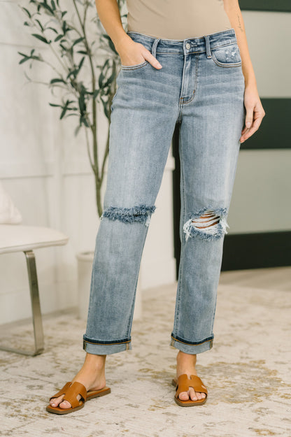Detail shot of Elaine Mid Rise Boyfriend Jeans by Judy Blue optional cuff hem styling.