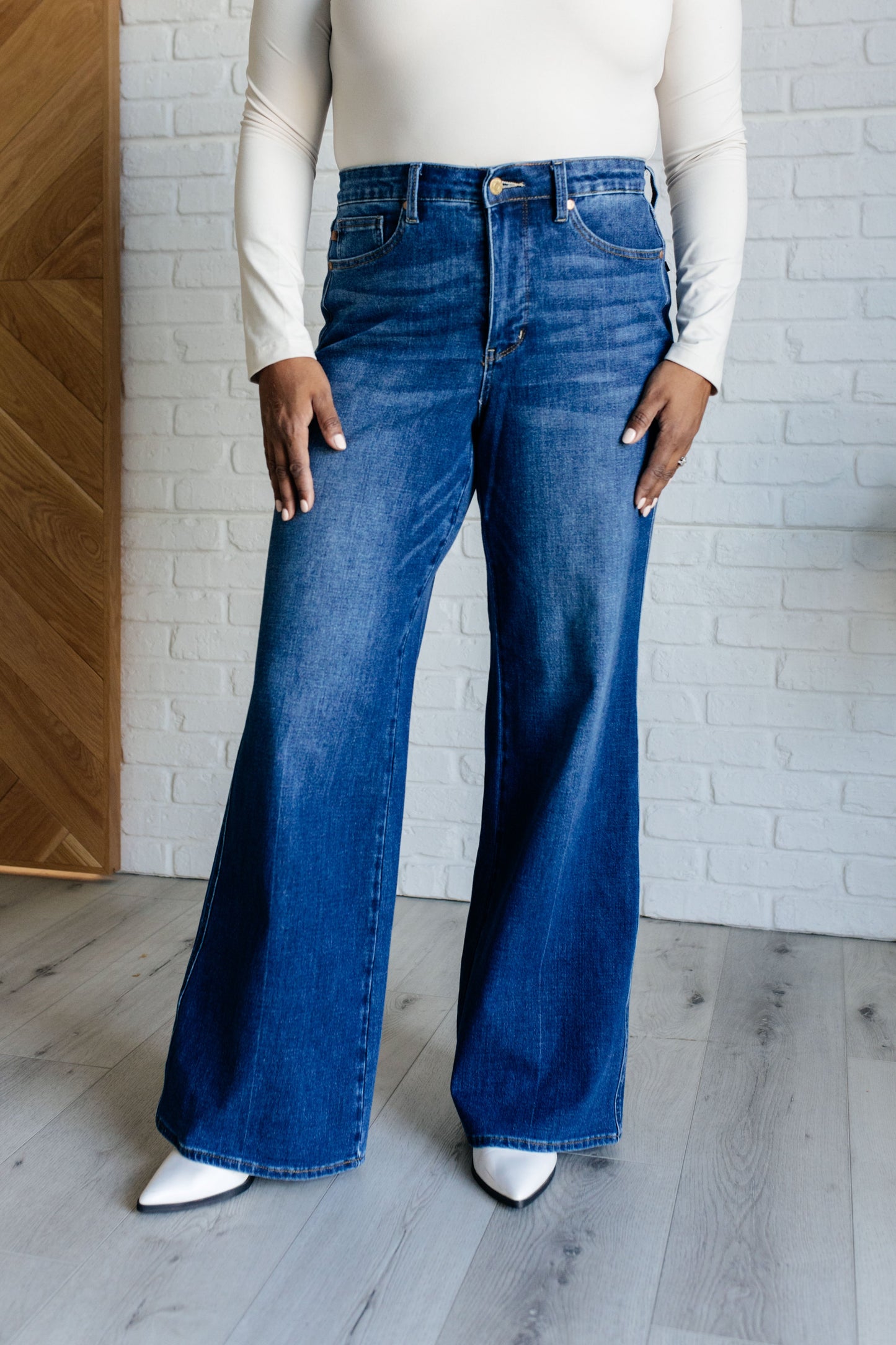 Judy Blue High Rise Control Top Retro Wide Leg Jeans in dark wash, featuring a zip fly, tummy control, and wide-leg silhouette. Plus Size.