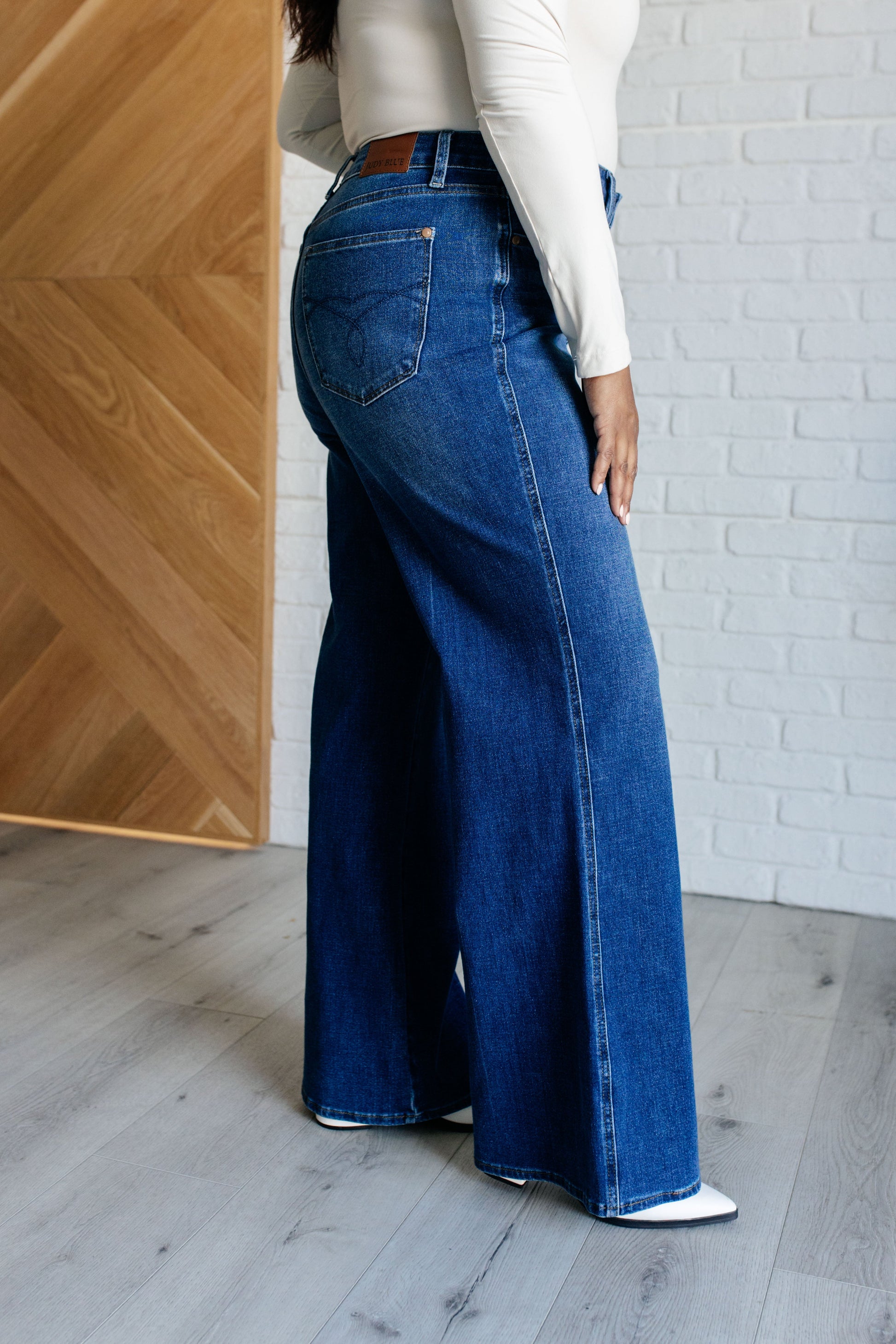 Judy Blue High Rise Control Top Retro Wide Leg Jeans in dark wash, featuring a zip fly, tummy control, and wide-leg silhouette. Plus Size.