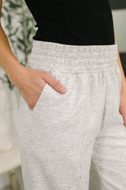 Close-up of Evani Jogger Bottoms showing cased elastic waistband and pockets.