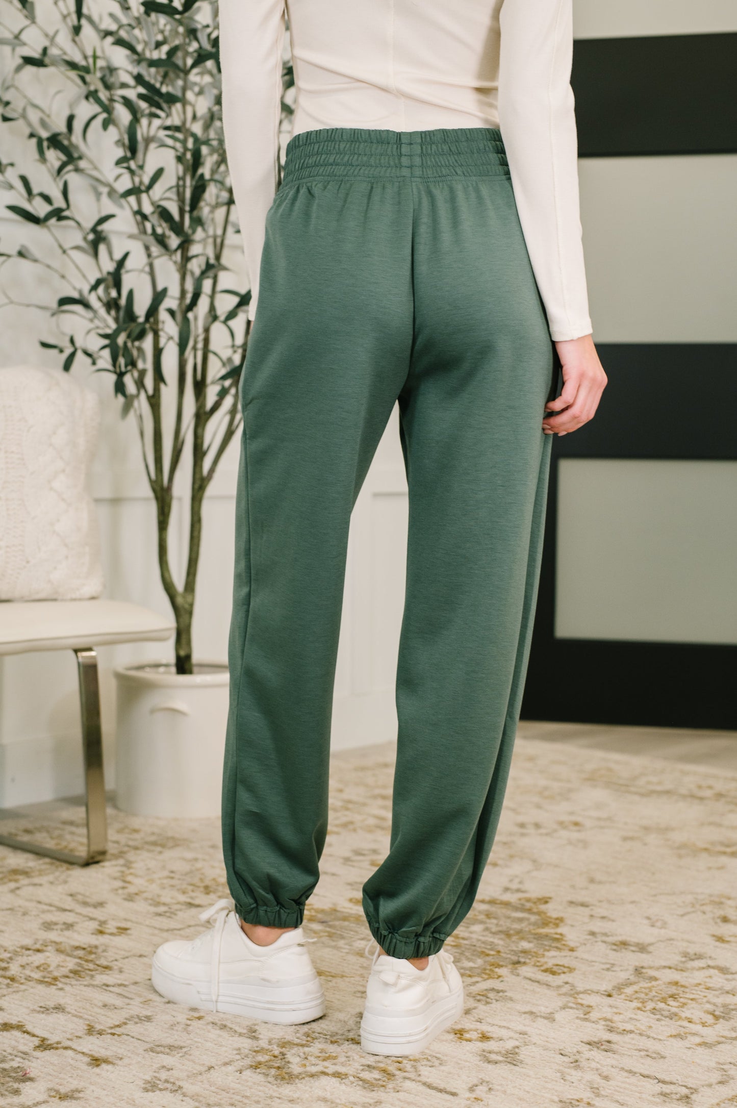 Back view of Evani Jogger Bottoms showing elastic hem and relaxed jogger fit.