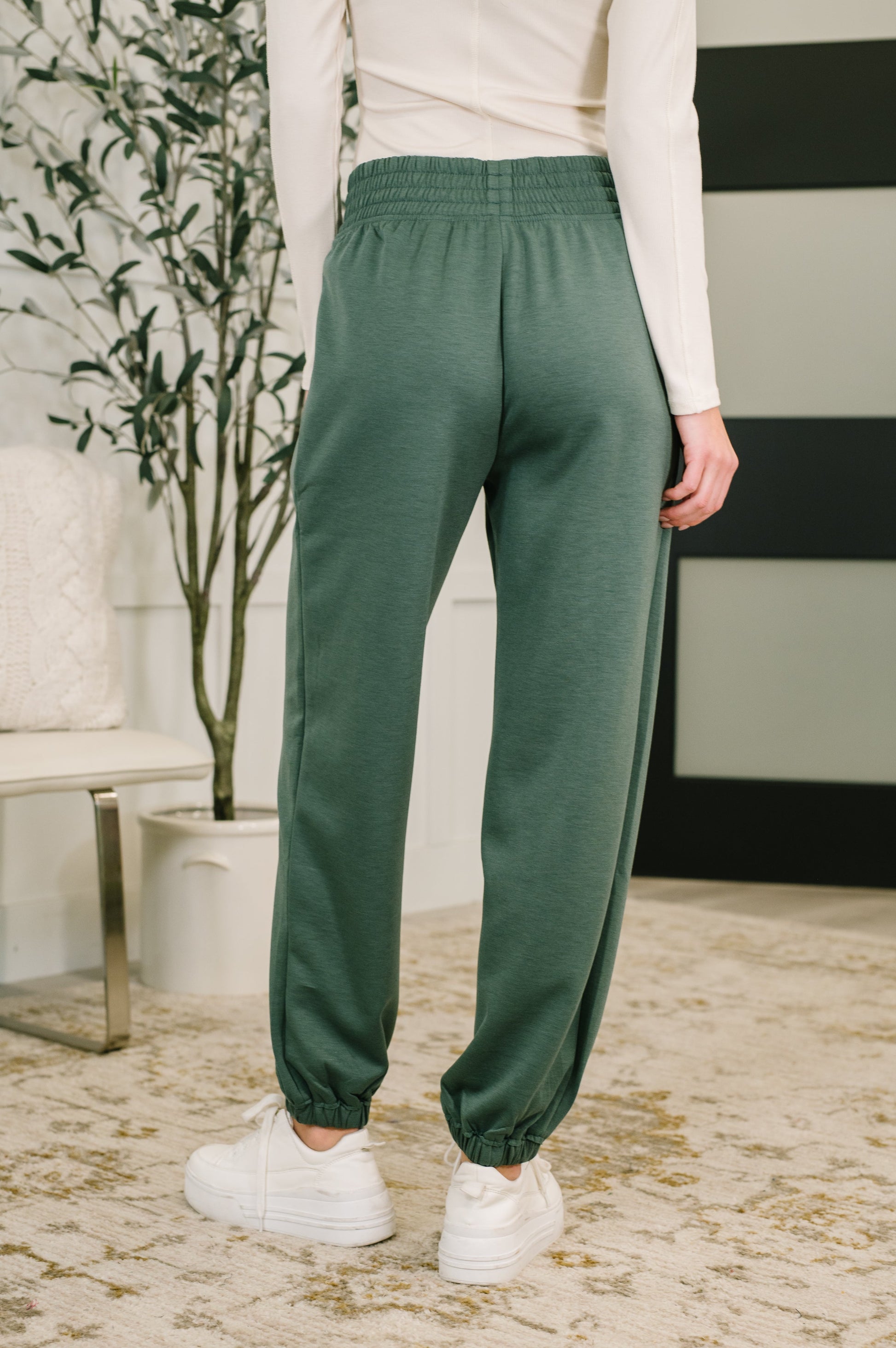 Back view of Evani Jogger Bottoms showing elastic hem and relaxed jogger fit.