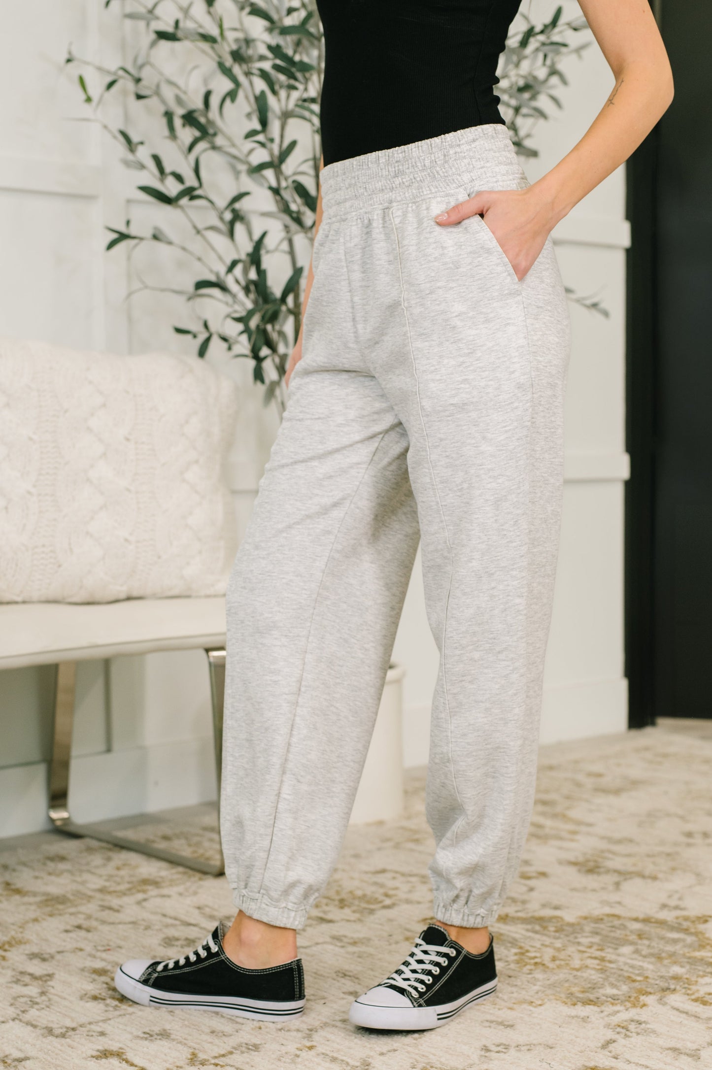 Side angle of Evani Jogger Bottoms highlighting exposed seam details.