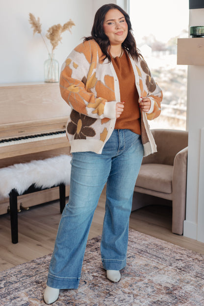 Plus size model full body in Zizi Knitted Sweater Top, rust color with boat neckline and cozy fit
