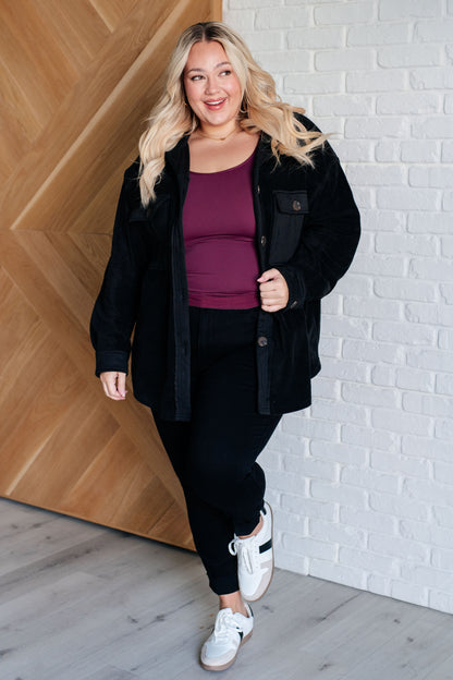 Plus size model adjusting Akeelah Fleece Jacket showing relaxed fit.