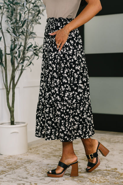 Side view of Virginia Floral Skirt highlighting pockets and pleated tiers.