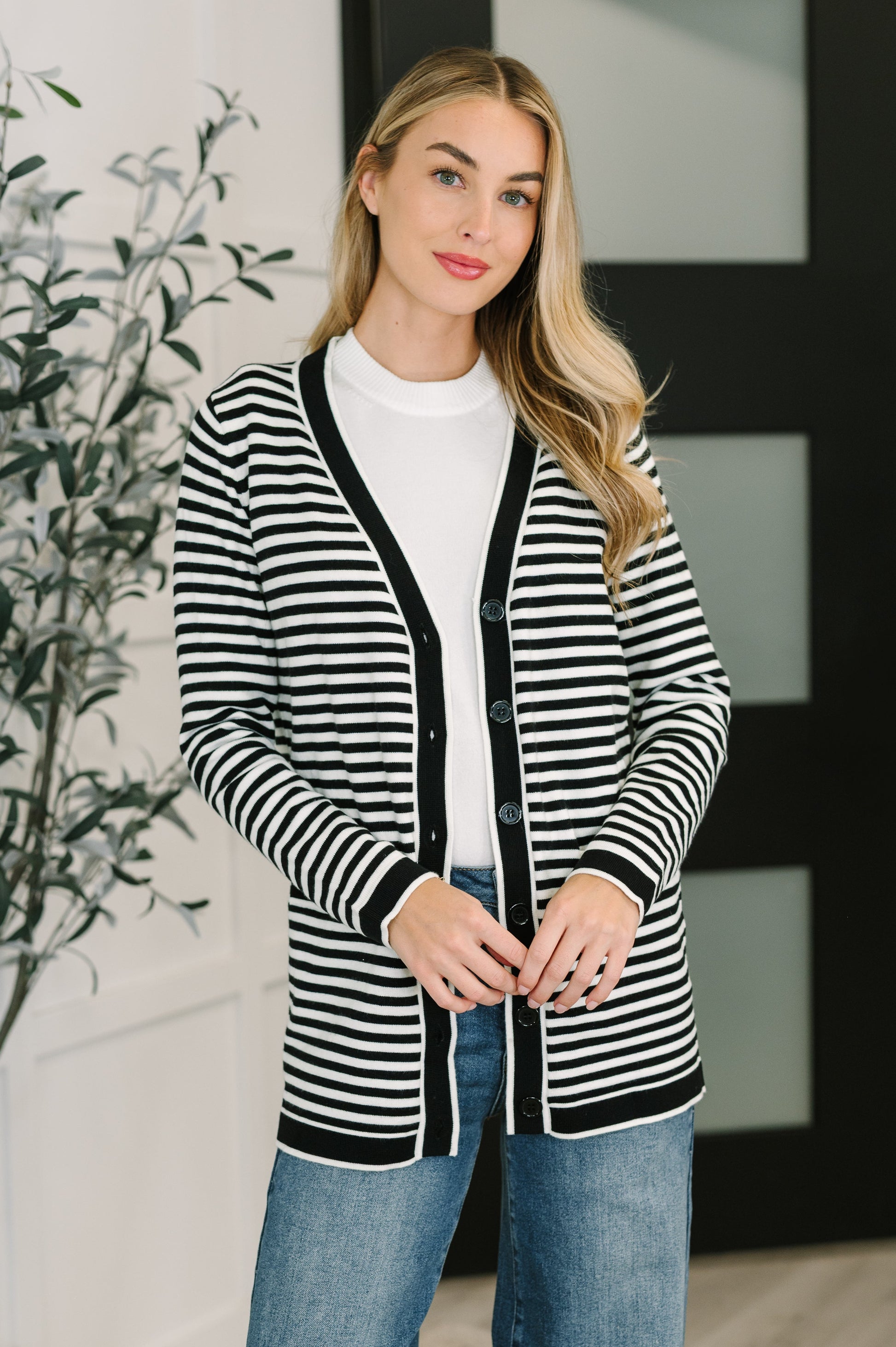 Finn Striped Cardigan in Black and White, front view showing button closure and V-neckline.