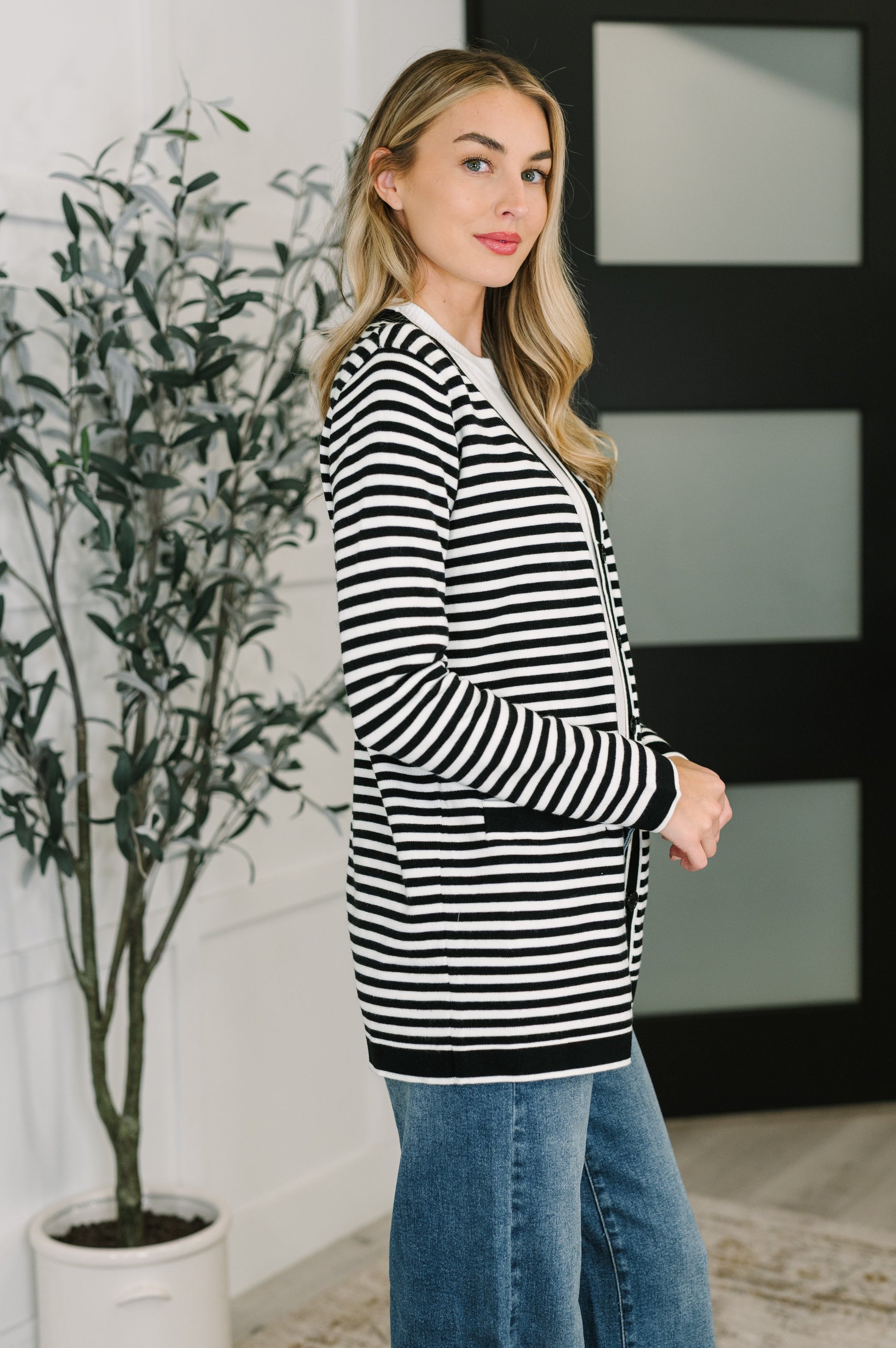 Side view of Finn Striped Cardigan highlighting light-mid weight sweater knit texture.