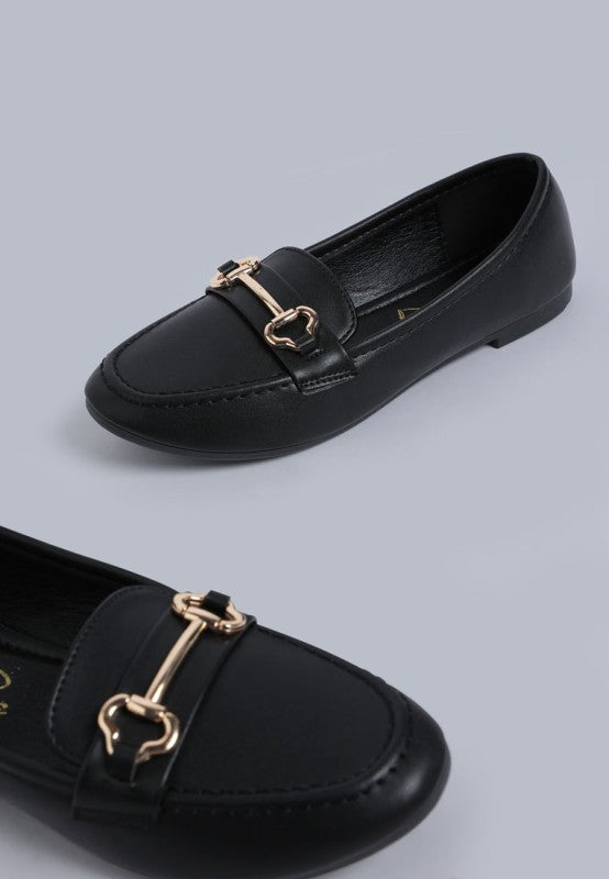 Flat lay of Pingle Horsebit Faux Leather Loafers in Black classic workwear slip on shoes.