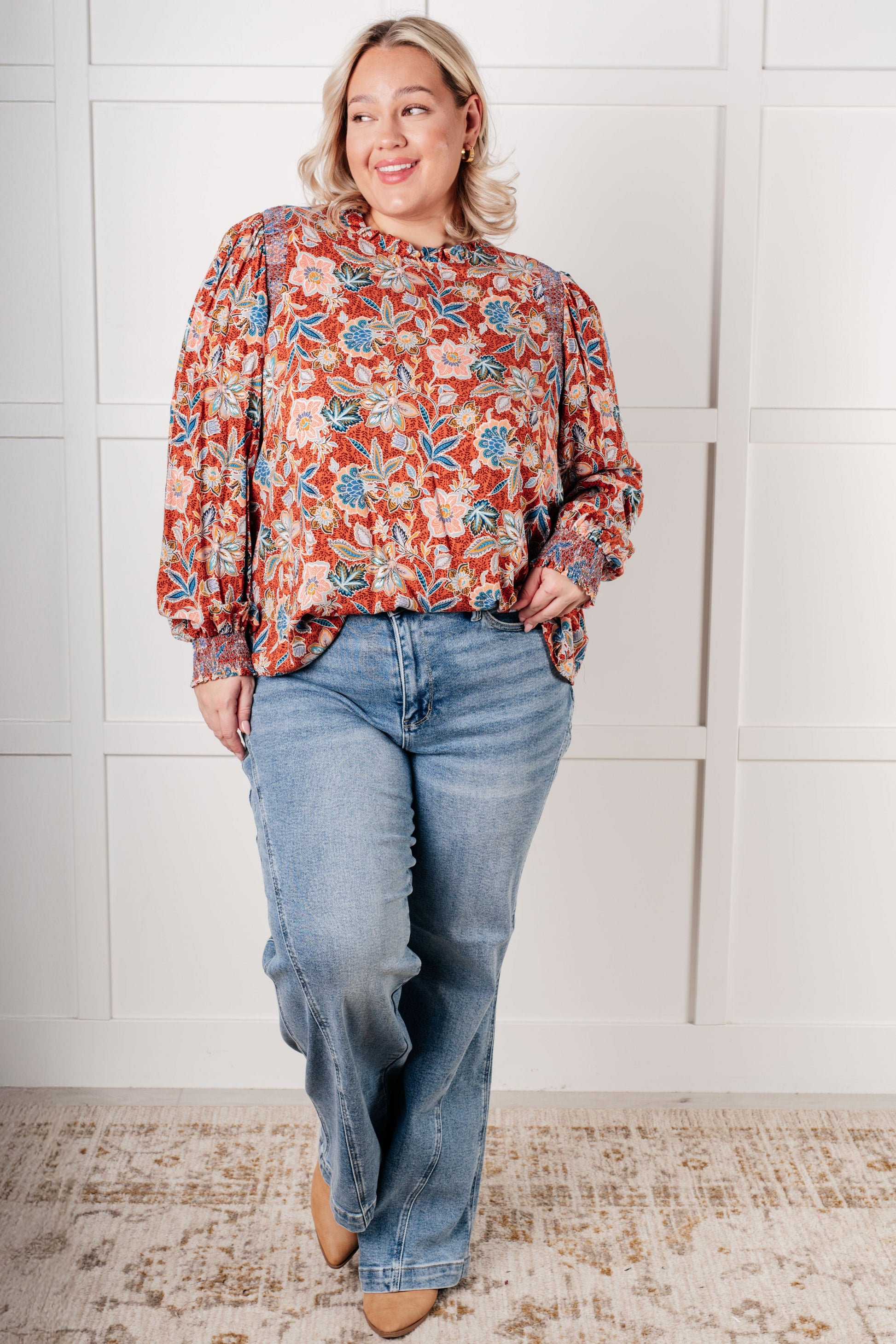 Plus size full body view of Blair Floral Blouse paired with jeans showing relaxed fit and floral print.