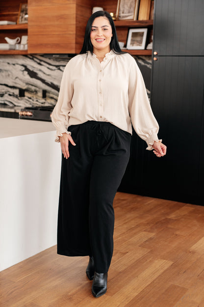 Model wearing plus size Florence Blouse cream crinkle woven fabric front.