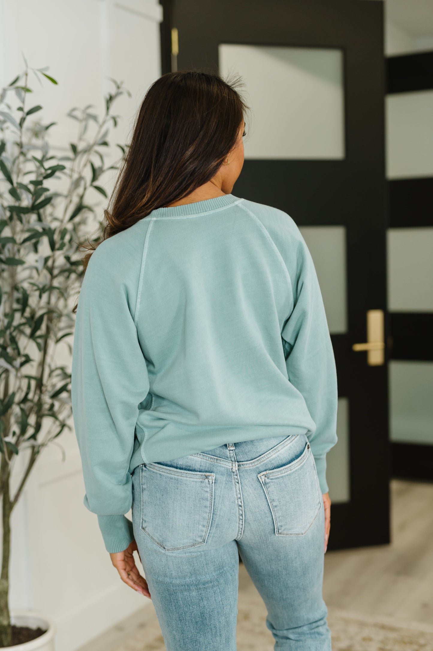 Hallie Relaxed Pullover in Ash Blue back view showing ribbed hemline and relaxed silhouette