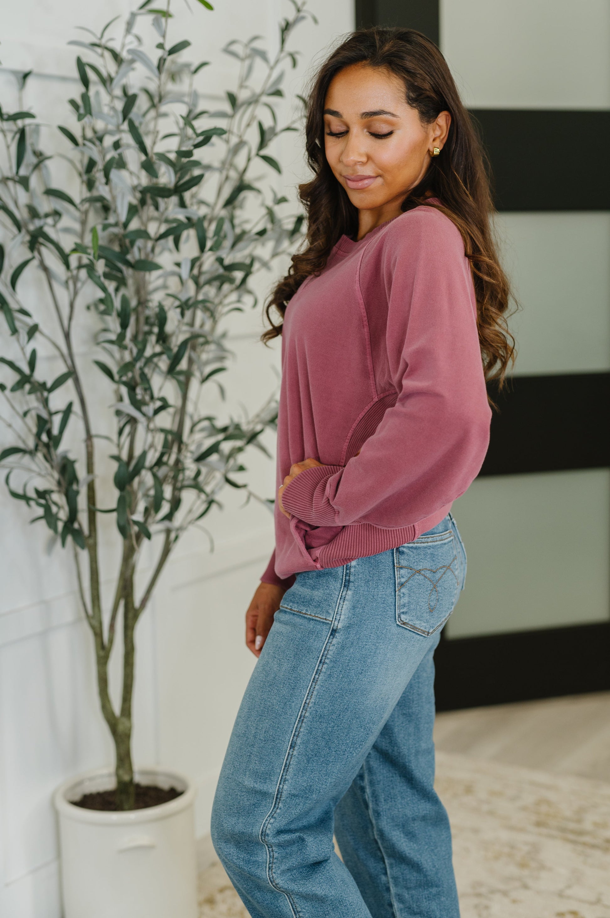 Side view of cabernet Hallie Relaxed Pullover with dolman sleeve and relaxed fit design