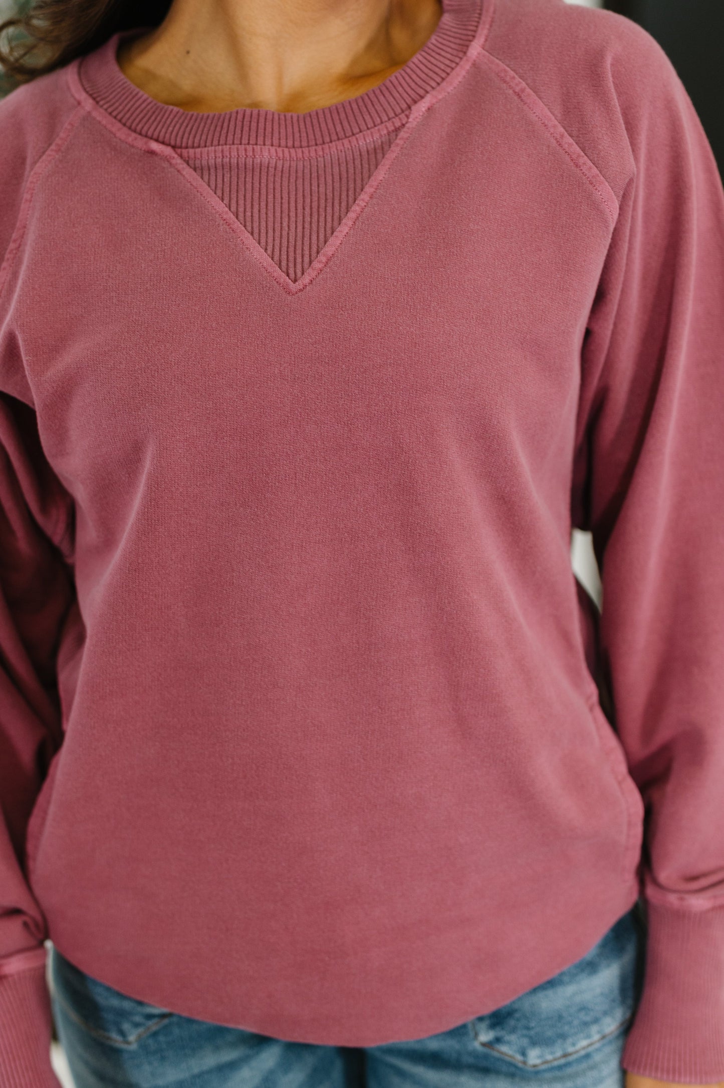 Close up of cabernet Hallie Relaxed Pullover showing ribbed contrast neckline, cuffs, and hemline details