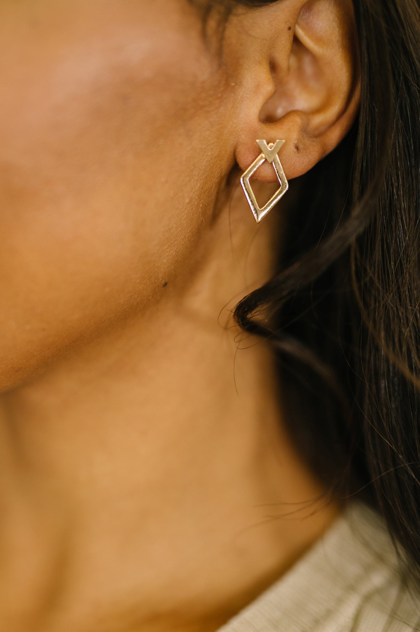 Geometric Rhombus Stud Earrings worn together for a bold geometric look.