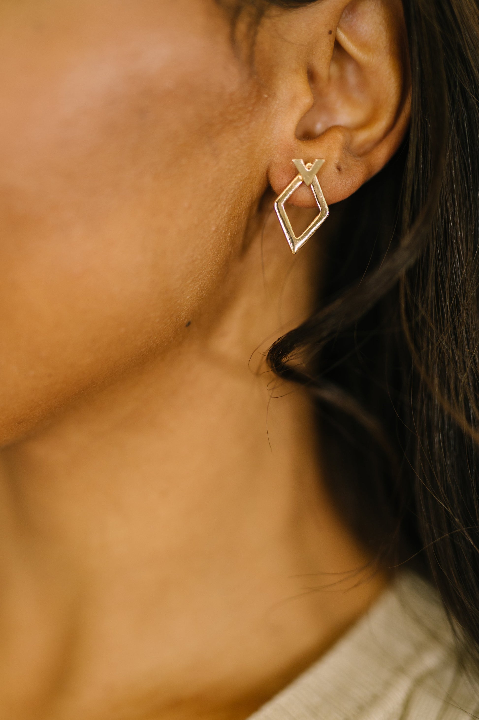Geometric Rhombus Stud Earrings worn together for a bold geometric look.