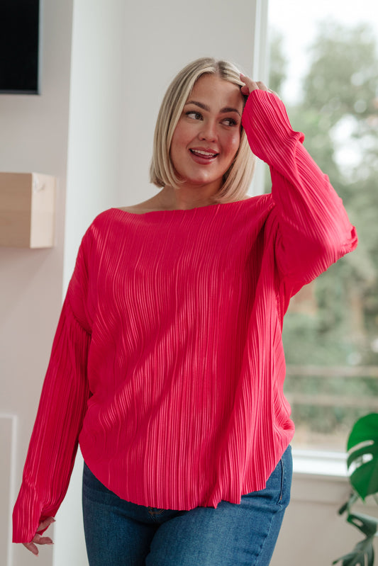 Plus size model wearing Gigi Plisse Top in pink pleated satin.